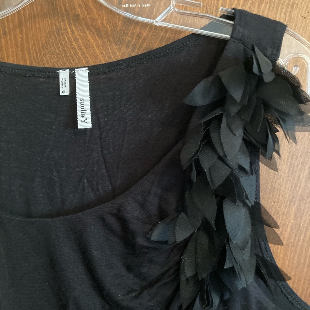 Swoop neck tank with feather detail.
